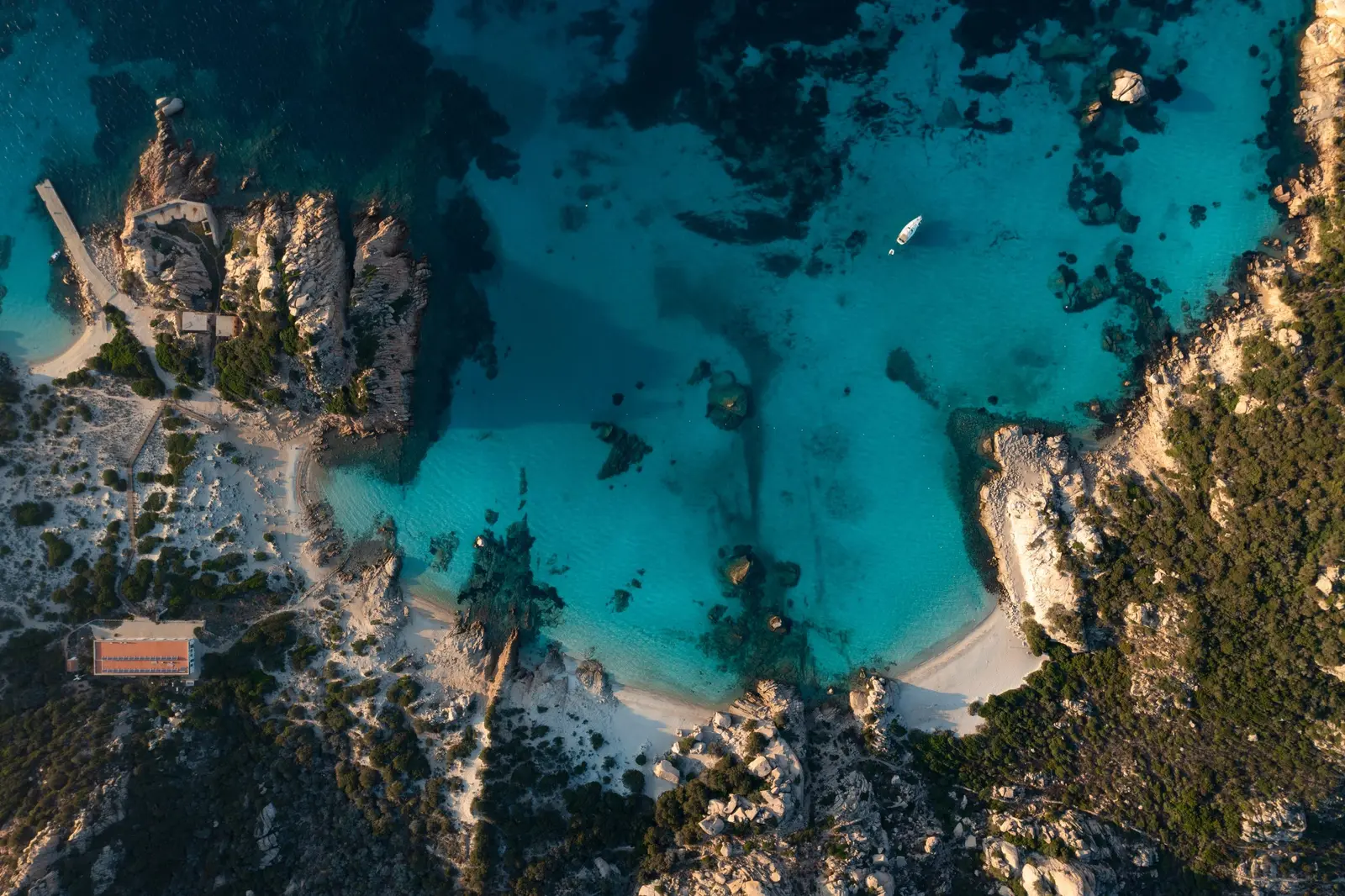 Cala Granara on Spargi island, crystal-clear water and lush vegetation