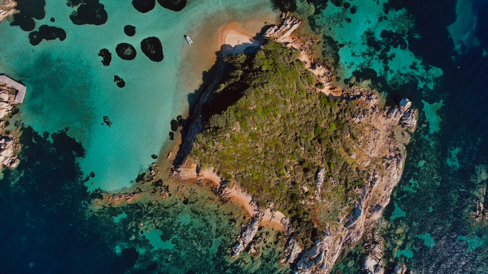 Aerial view of a cove with a beach in the La Maddalena archipelago