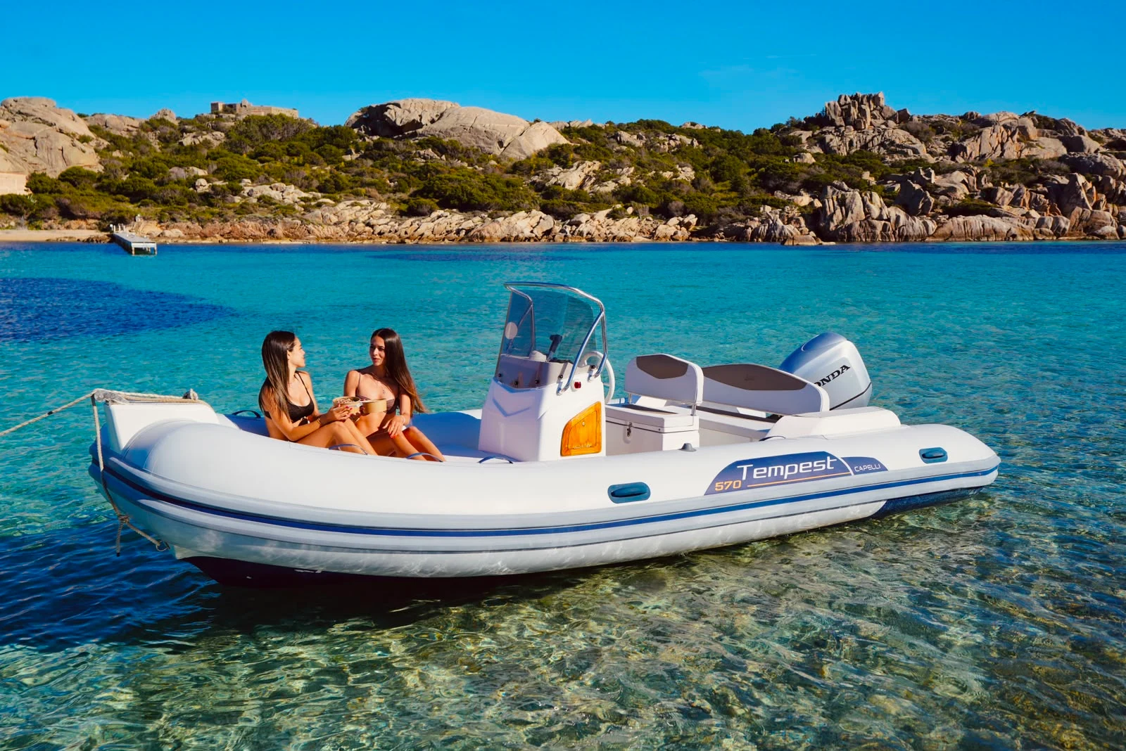 Capelli Tempest 570 RIB at anchor in a turquoise cove of La Maddalena
